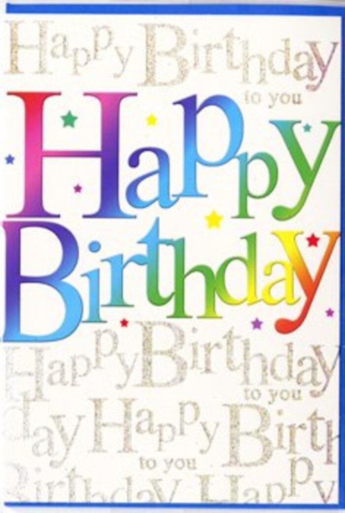 In this close-up photograph, a stylish birthday card is shown upright, its design bursting with colour in a way that echoes the seasonal displays outside shops on Pinner's main parade. The central feature is the phrase Happy Birthday, presented in large, rounded letters that have a slightly glossy, printed appearance, as if they were cut from strips of coloured ribbon. Each letter transitions through a smooth gradient of colour, moving from bold reds into warm oranges, then into creamy yellows, zesty greens, cool teals, and deep blues. The tones are vivid yet softened at the edges, creating a sense of gentle movement along the text, like the shifting shades in a well-blended flower arrangement. Behind this colourful headline, the entire background is filled with slender lines of gold script that repeat Happy Birthday to you in elegant, slightly slanted handwriting. The metallic gold appears subtly raised and reflective, catching soft highlights much like candlelight on a polished table during a birthday supper near Pinner Green. Scattered here and there around the main phrase are tiny accents-minute star shapes, dots, and specks in complementary colours-that give the impression of scatter confetti caught in mid-fall. The card's surface looks smooth and high-quality, with a satin finish that helps the rainbow hues and gold details stand out without glare. The photograph uses a neutral, out-of-focus background and balanced lighting so there are no distractions from the design itself. The overall feeling is one of joyful sophistication: a card that would pair perfectly with a bright hand-tied bouquet or a stylish hatbox arrangement, ready to be delivered across Pinner, North Harrow, and nearby residential streets for a birthday worth remembering.